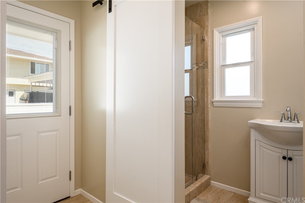 12430 Beverly Drive Whittier, CA 90601 - Photo 10 of 31 a bathroom with a sink and mirror with toilet