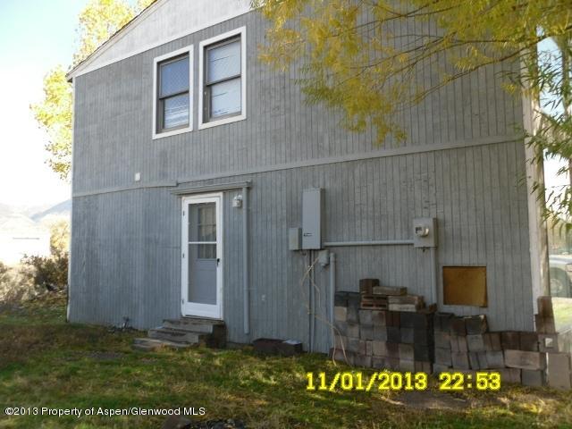 30075 Highway 6 Rifle, CO 81650 - Photo 1 of 14 a backyard of a house with lots of green space