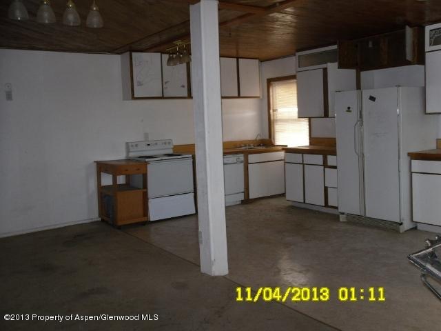 30075 Highway 6 Rifle, CO 81650 - Photo 7 of 14 a kitchen with refrigerator and stove