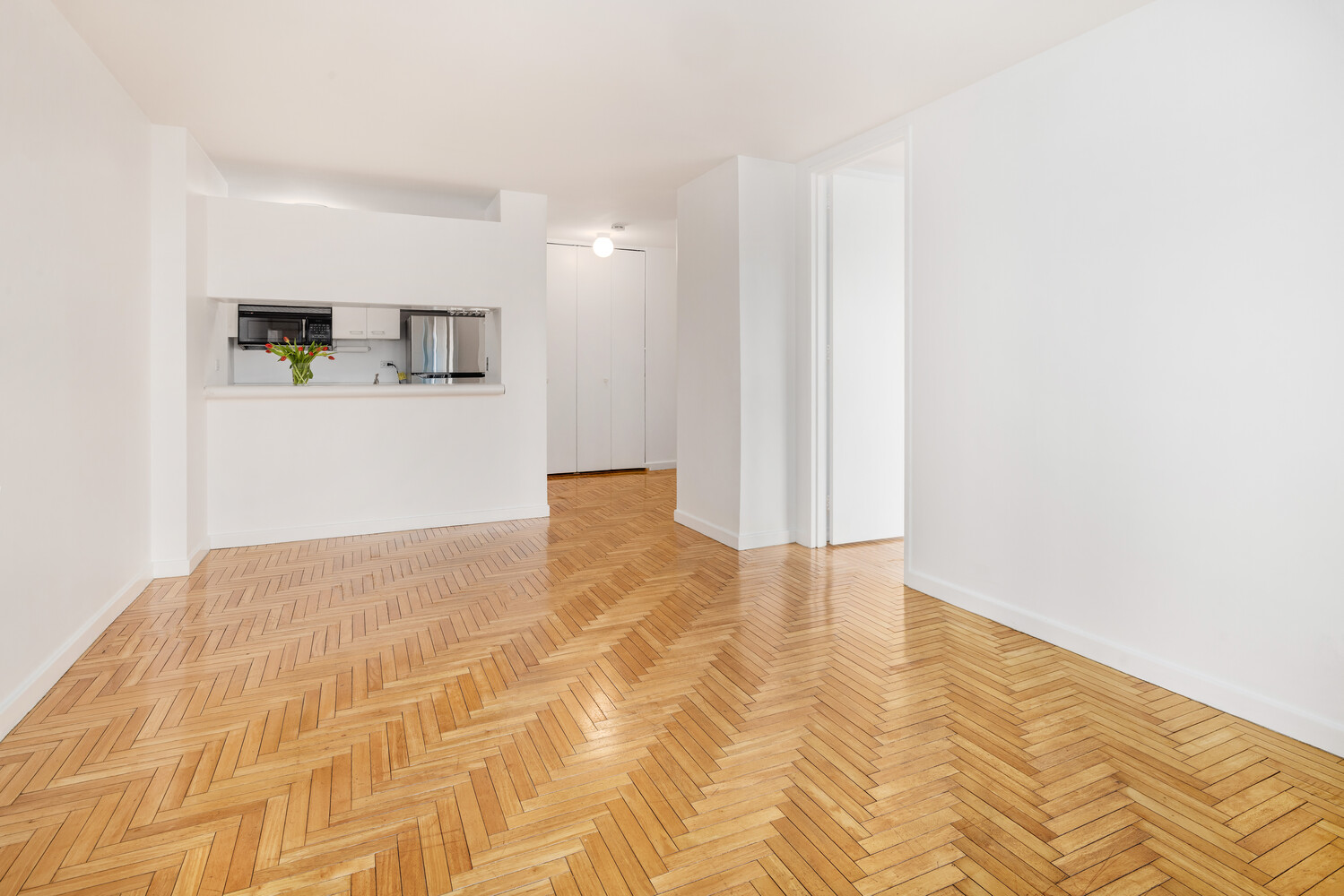 401 East 84th Street, Unit 5D Manhattan, NY 10028 - Photo 3 of 7 a view of a livingroom with wooden floor