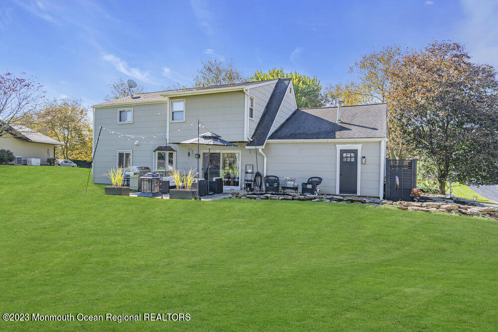 8 Hillside Road Manalapan, NJ 07726 - Photo 49 of 59 a view of a house with a back yard