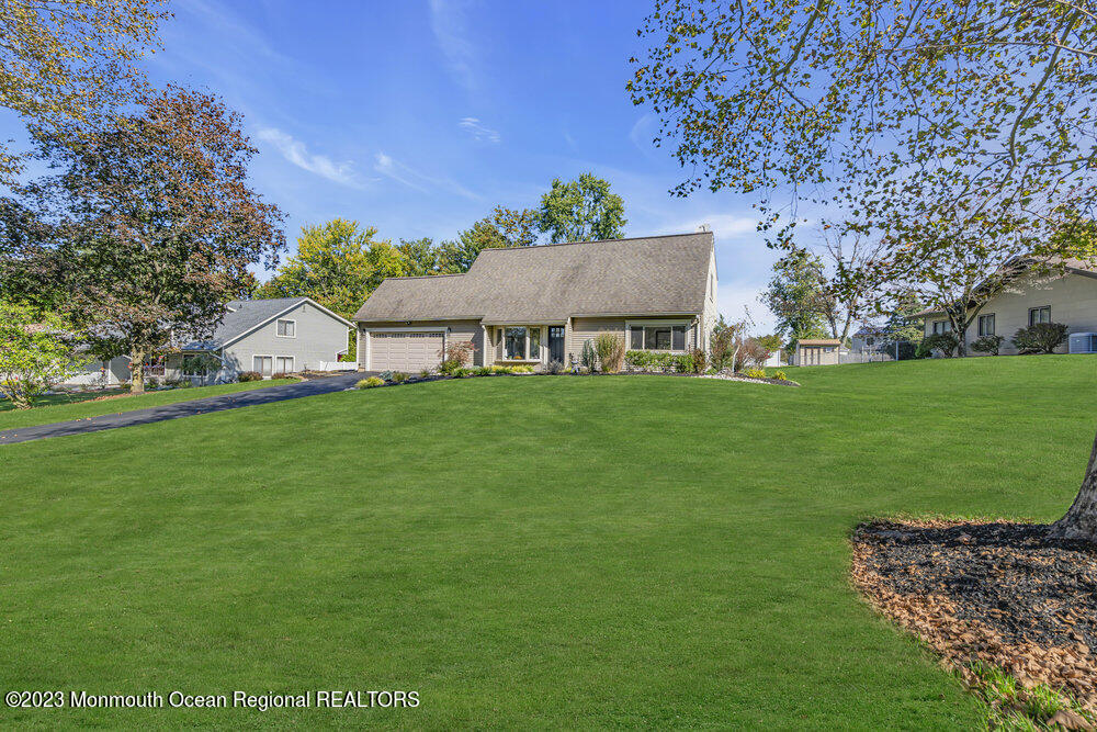 8 Hillside Road Manalapan, NJ 07726 - Photo 5 of 59 a view of a house with a yard