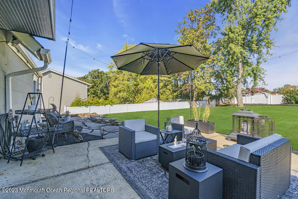 8 Hillside Road Manalapan, NJ 07726 - Photo 53 of 59 a view of an outdoor sitting area with furniture