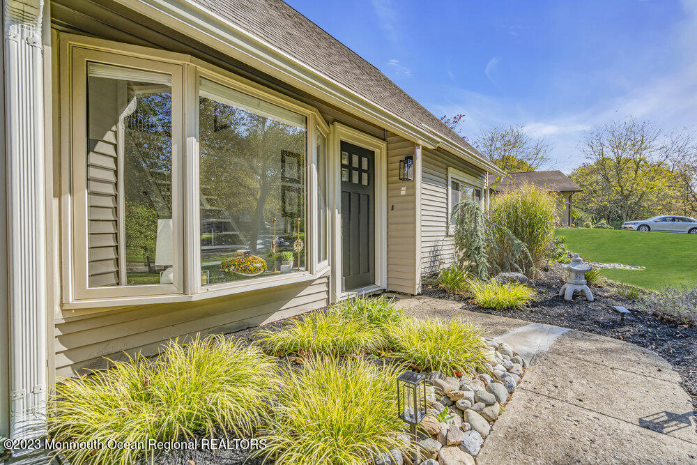 8 Hillside Road Manalapan, NJ 07726 - Photo 7 of 59 a view of a house with a backyard