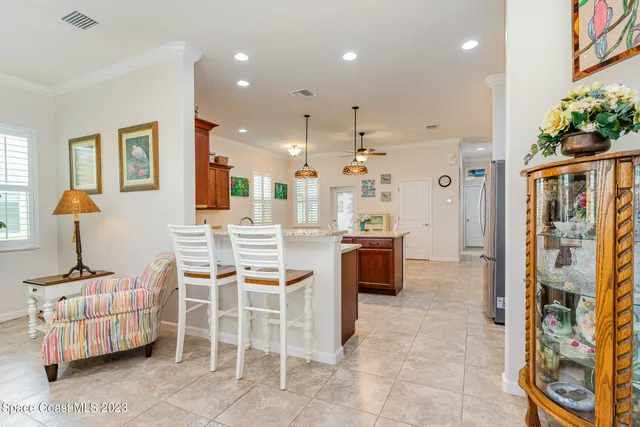 a dining room with furniture and natural light