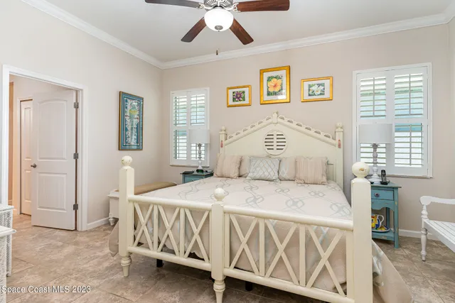 a bedroom with a bed and a table