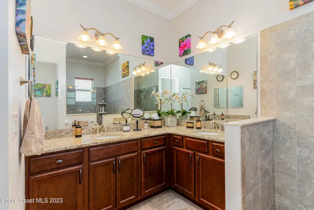 a bathroom with a sink vanity and a mirror