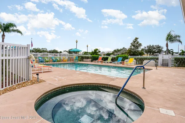 a swimming pool with a view of trees in the background
