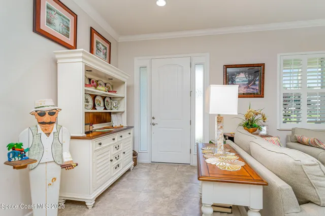 a bedroom with furniture and a book shelf