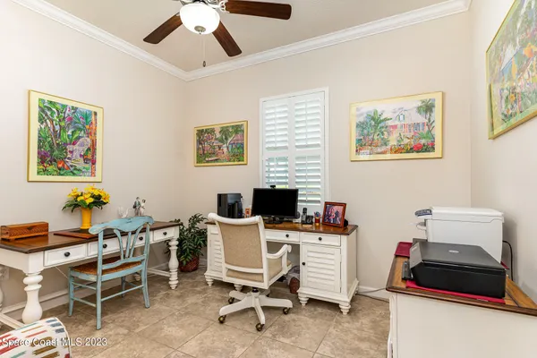 a work room with furniture and a window