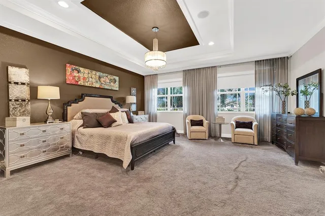 a spacious bedroom with a bed and a couch