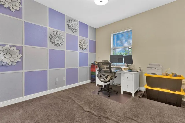 a view of a workspace with furniture