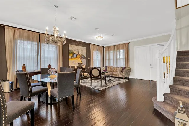 a view of a livingroom with furniture window and wooden floor