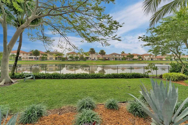 a view of a lake with houses in the back