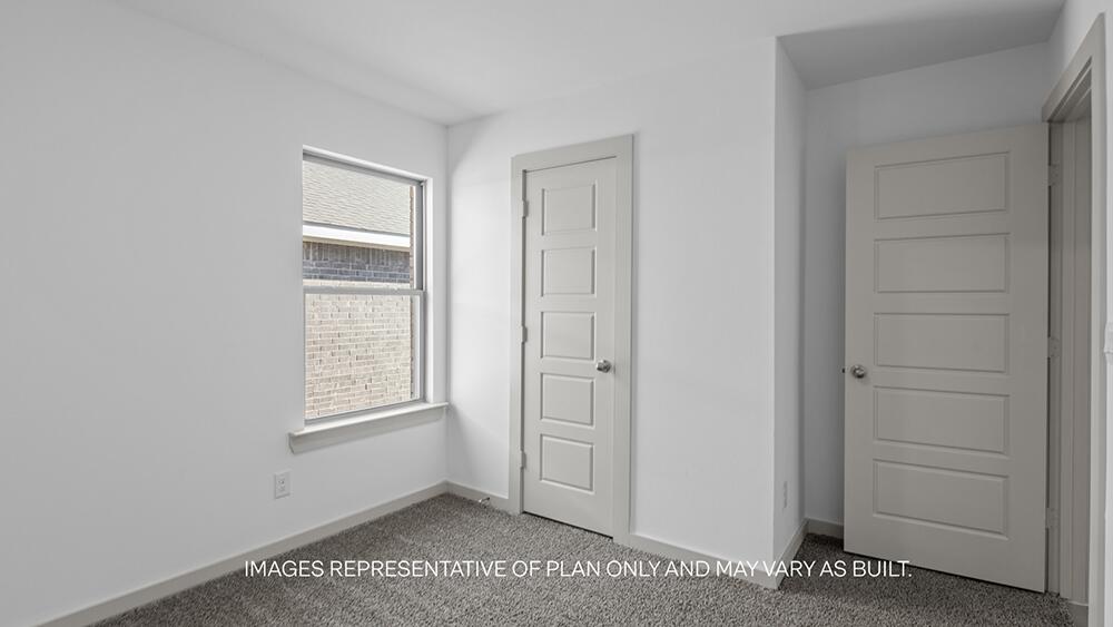 7331 9th Street Lubbock, TX 79416 - Photo 11 of 13 a view of an empty room with closet and window