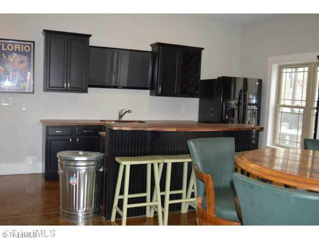 278 Jesse King Road Advance, NC 27006 - Photo 14 of 16 Other. Daylight basement has wet bar, dining area, den with fireplace, bedroom aand bath- perfect inlaw suite with private entrance