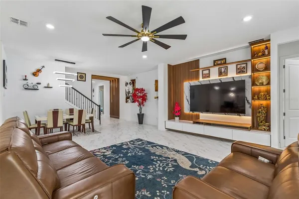 a open kitchen with stainless steel appliances granite countertop a sink counter space cabinets and a counter top space