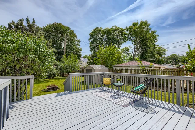 a view of balcony with deck and trees