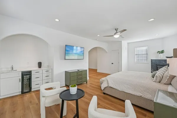 a bedroom with a bed and a lamp