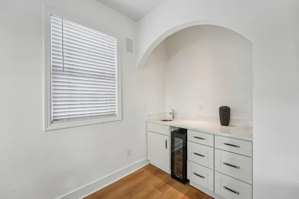 a bathroom with a double vanity sink toilet mirror and shower
