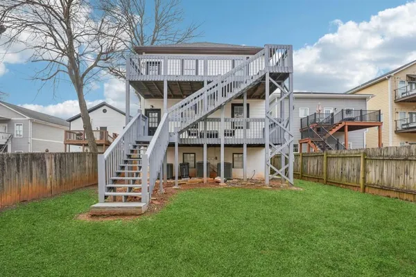 a view of a balcony with chairs