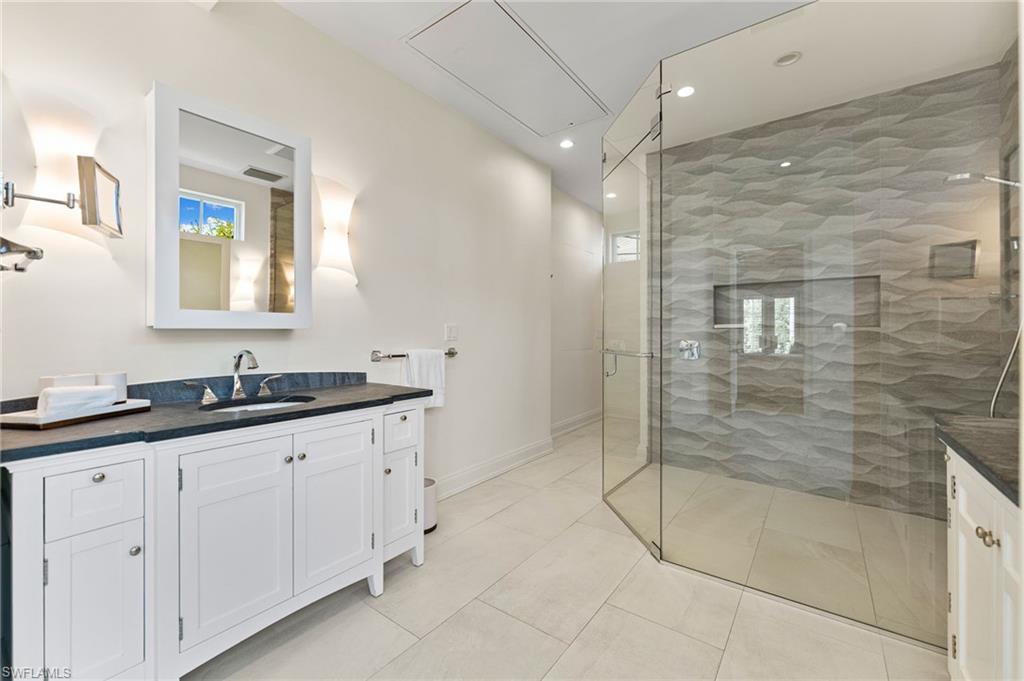 2325 Lantern Lane Naples, FL 34102 - Photo 21 of 50 Full bathroom with vanity, visible vents, recessed lighting, a stall shower, and baseboards