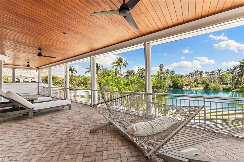 2325 Lantern Lane Naples, FL 34102 - Photo 36 of 50 View of patio / terrace featuring a water view and ceiling fan