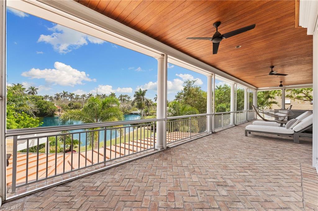 2325 Lantern Lane Naples, FL 34102 - Photo 37 of 50 View of patio featuring ceiling fan and a water view