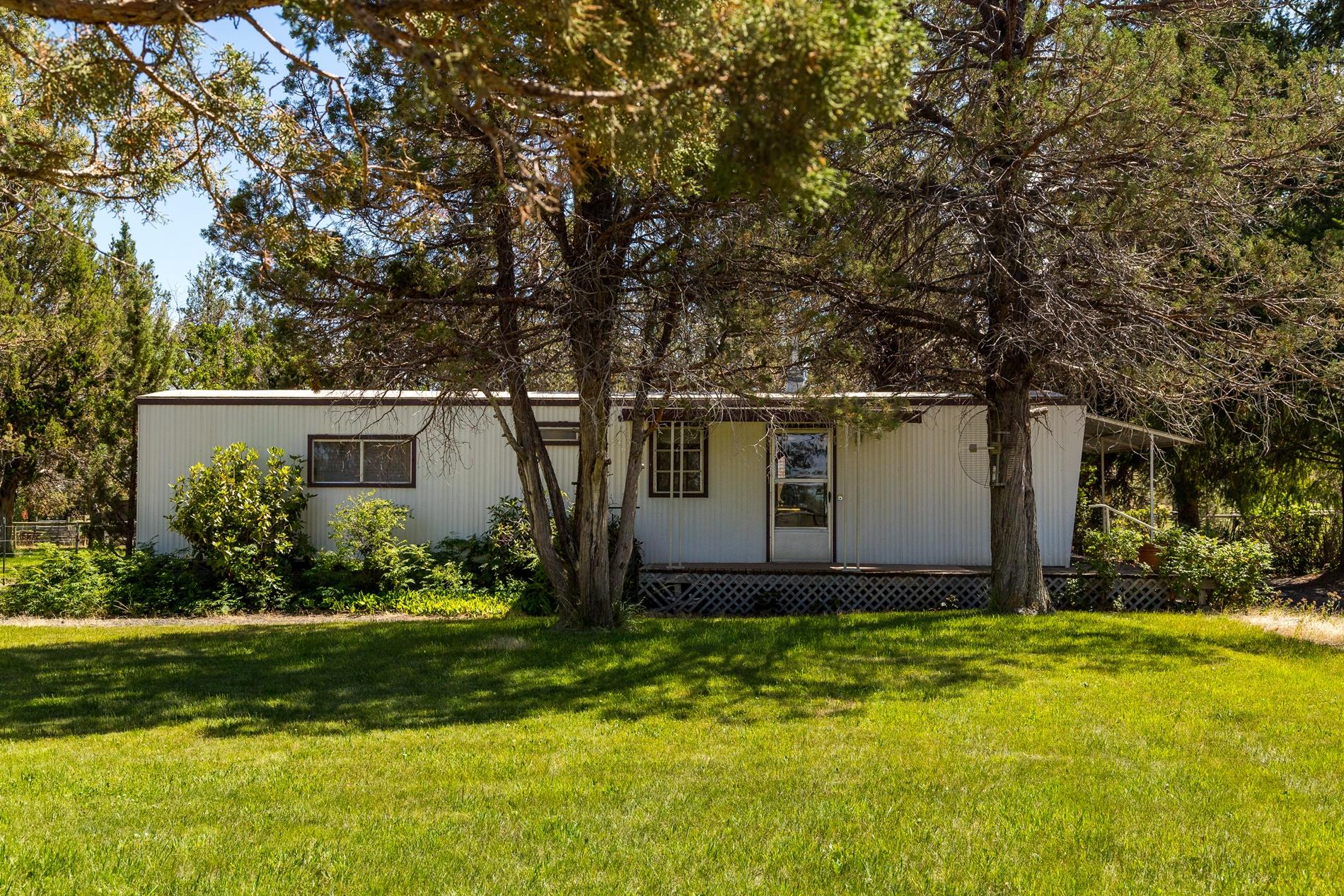 64980 Gerking Market Road Bend, OR 97703 - Photo 30 of 35 This 920 SF manufactured home has 2 bedrooms & 2 bathrooms. It is located at the West side of the property and has it's own gate for access.