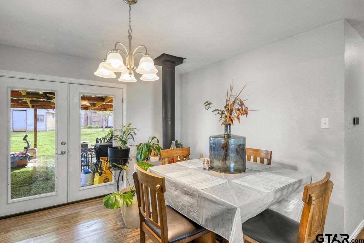 2954 Highway 322 Longview, TX 75603 - Photo 13 of 30 a view of a dining room with furniture window and wooden floor