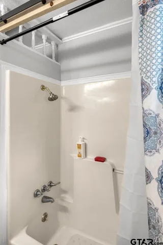 a bathroom with a white bath tub