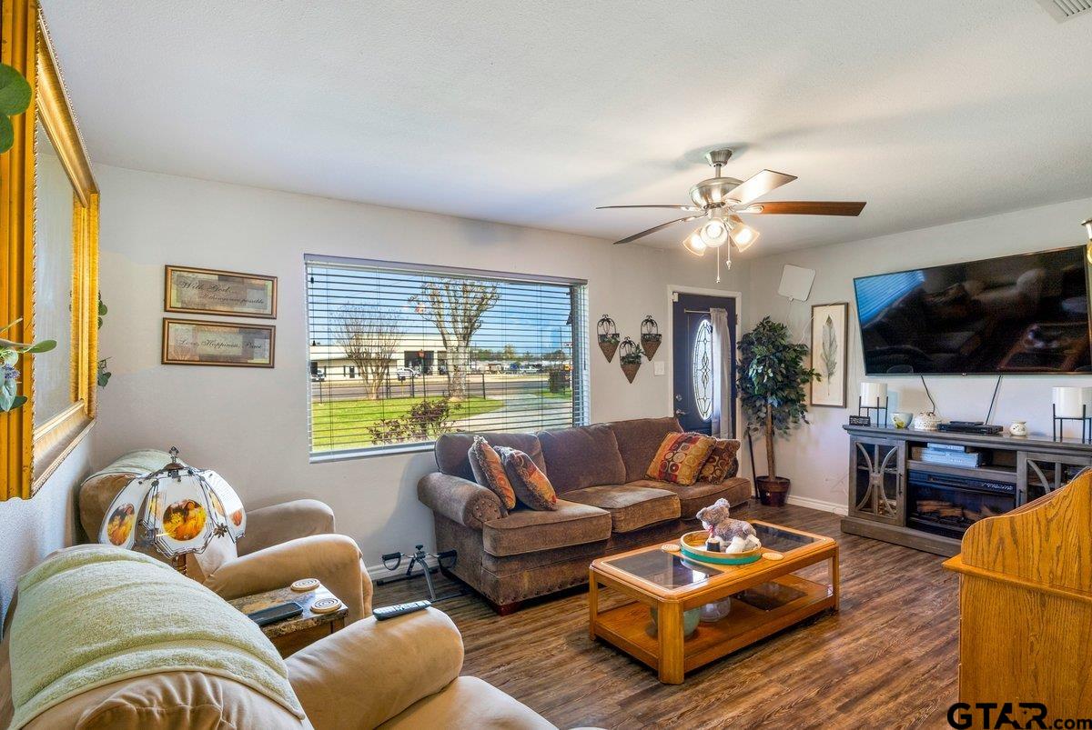 2954 Highway 322 Longview, TX 75603 - Photo 5 of 30 a living room with furniture and a flat screen tv