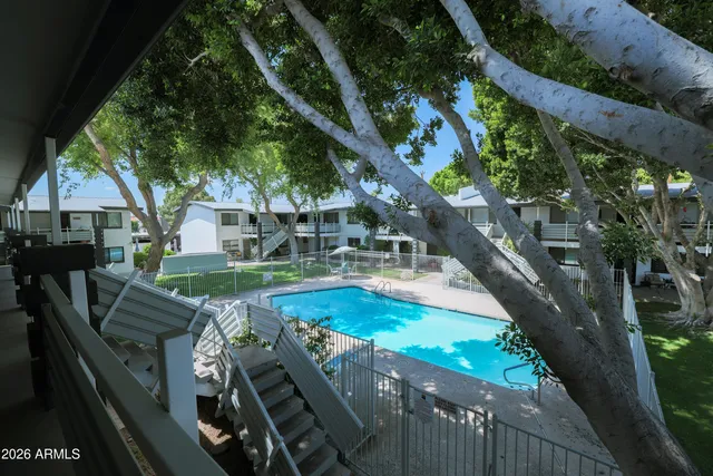 a view of swimming pool with seating area