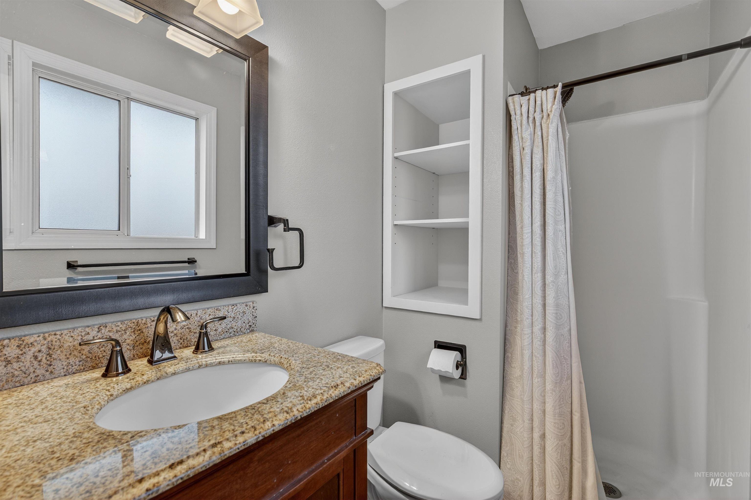 2814 22nd Street Clarkston, WA 99403 - Photo 14 of 33 Bathroom featuring a shower stall and vanity