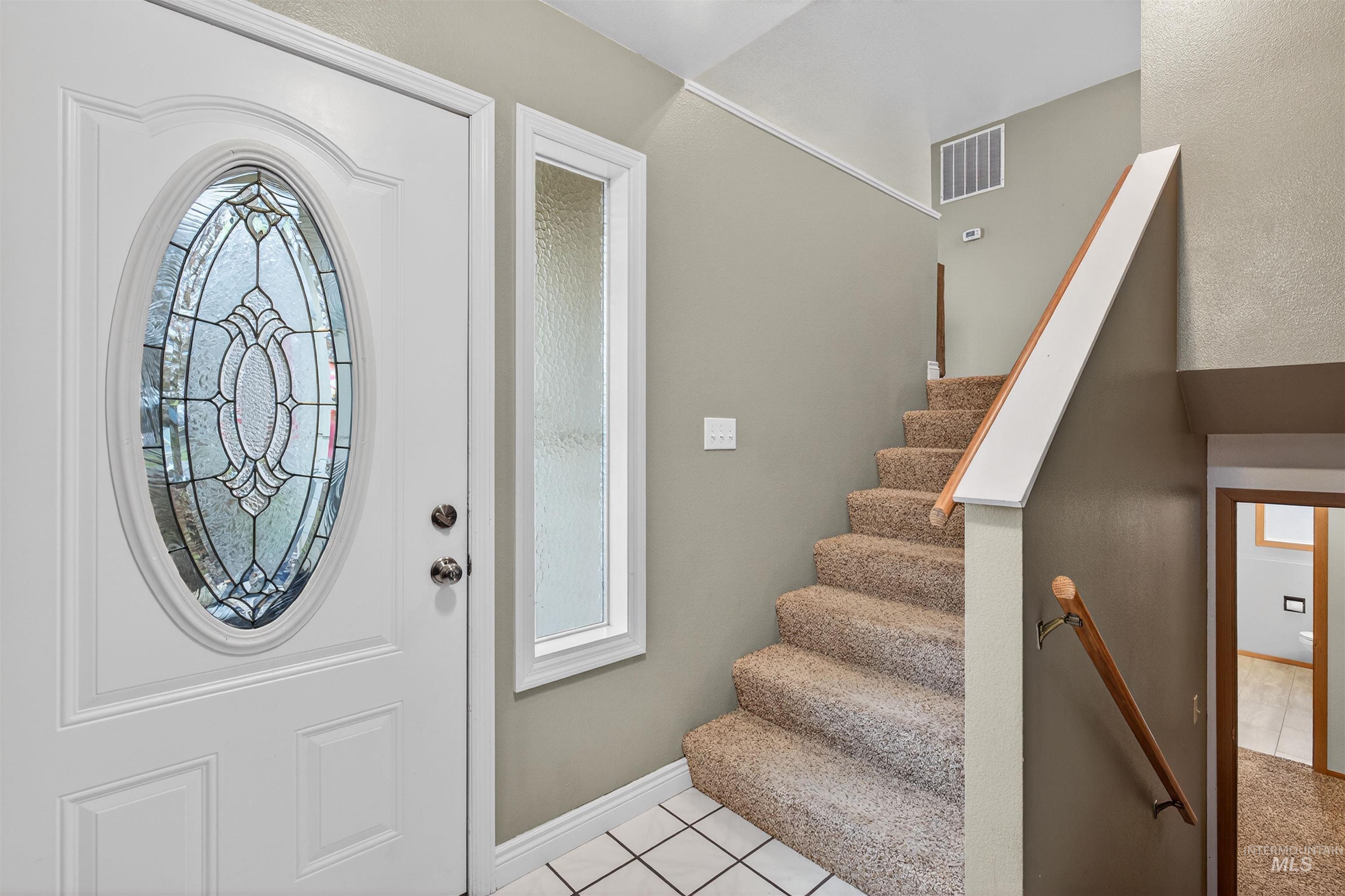 2814 22nd Street Clarkston, WA 99403 - Photo 18 of 33 Entryway with light tile patterned floors and stairs