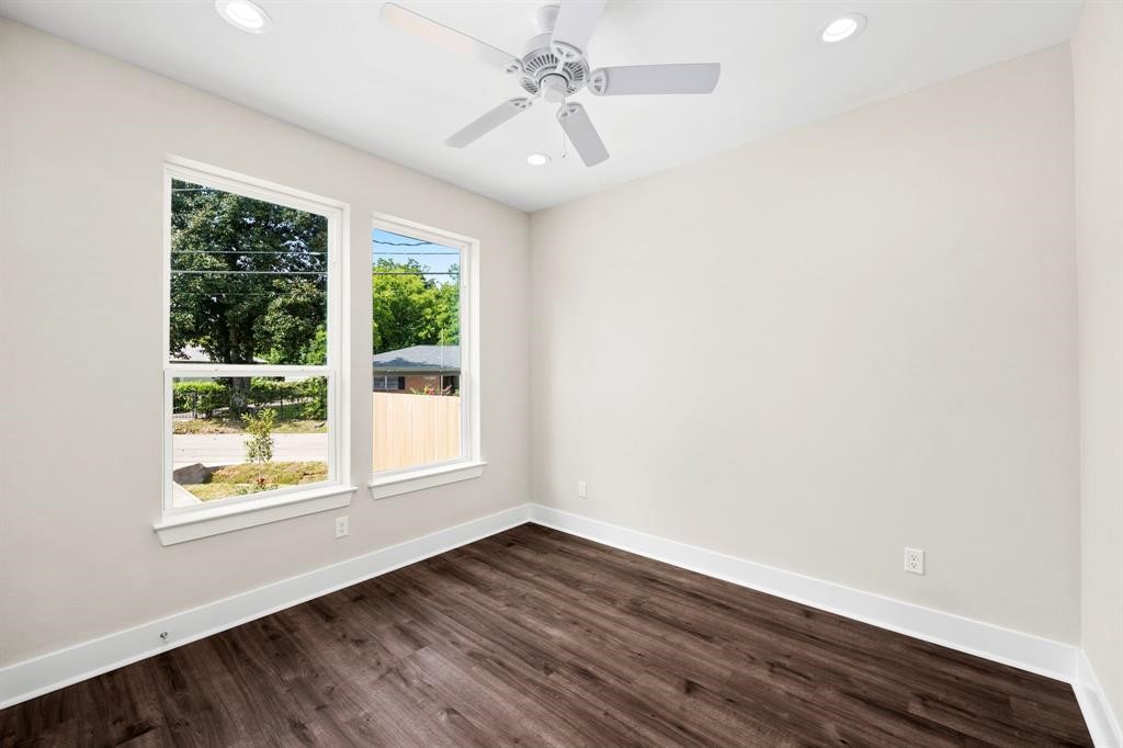 6832 Morrow Street, Unit A Houston, TX 77091 - Photo 3 of 16 a view of an empty room with wooden floor and a window