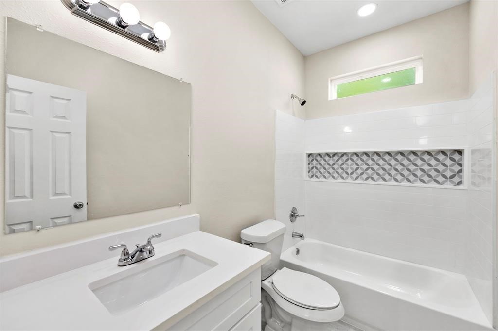 6832 Morrow Street, Unit A Houston, TX 77091 - Photo 4 of 16 a bathroom with a sink toilet and shower