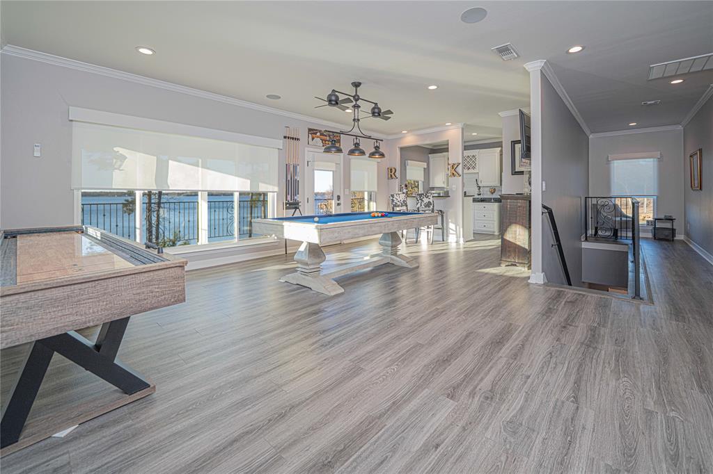 145 County Road Pittsburg, TX 75686 - Photo 21 of 39 a room with stainless steel appliances wooden floor dining table and chairs