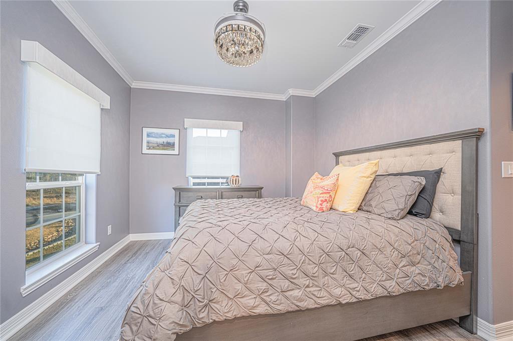 145 County Road Pittsburg, TX 75686 - Photo 25 of 39 a bedroom with a large bed and a window