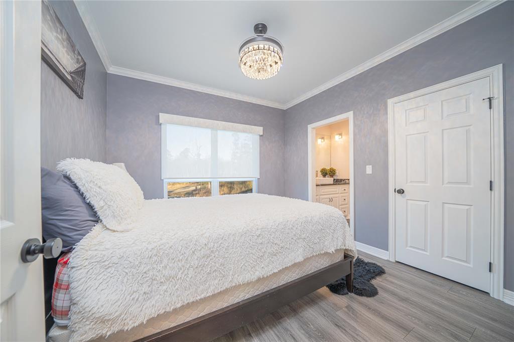 145 County Road Pittsburg, TX 75686 - Photo 27 of 39 a bedroom with a bed and a window