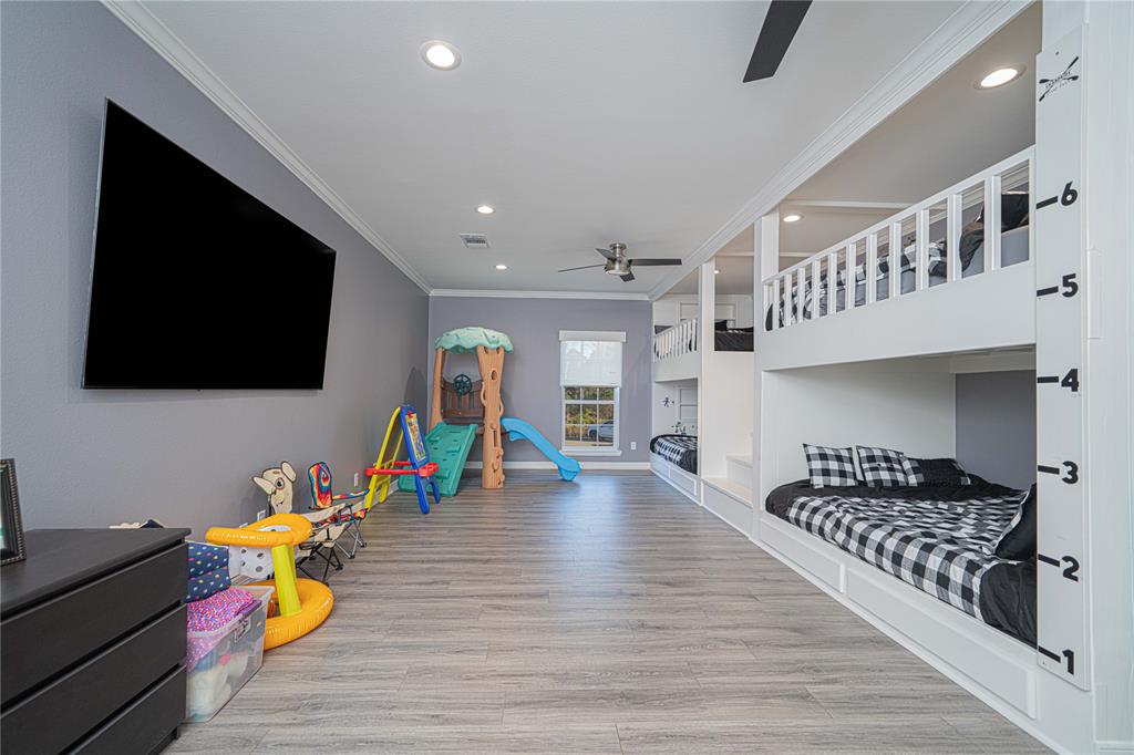 145 County Road Pittsburg, TX 75686 - Photo 30 of 39 a living room with furniture and a flat screen tv