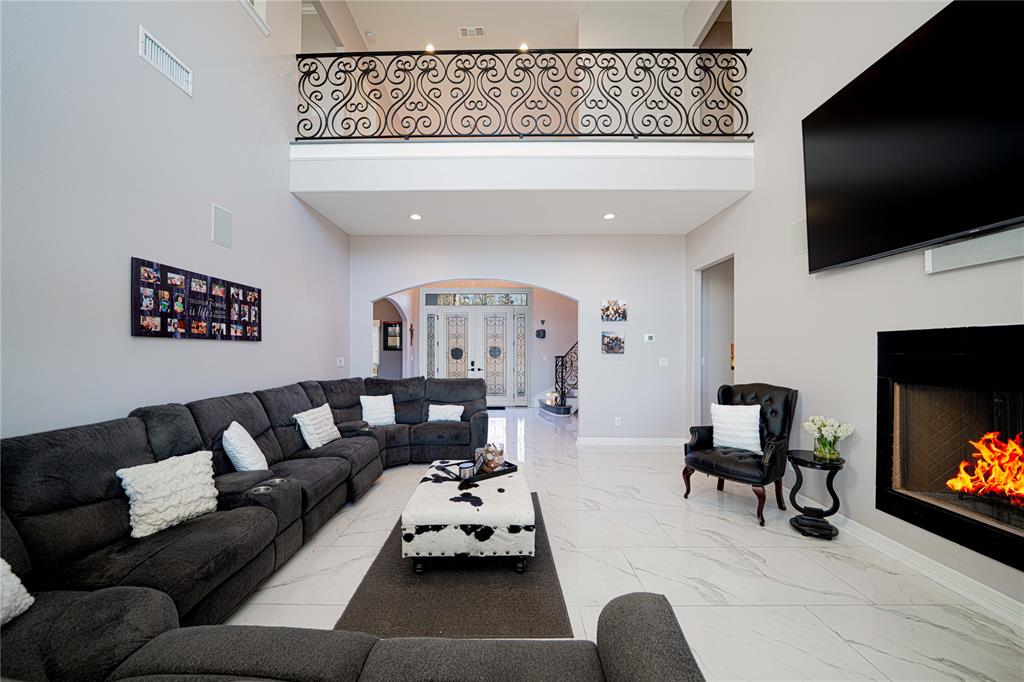 145 County Road Pittsburg, TX 75686 - Photo 5 of 39 a living room with furniture and a flat screen tv