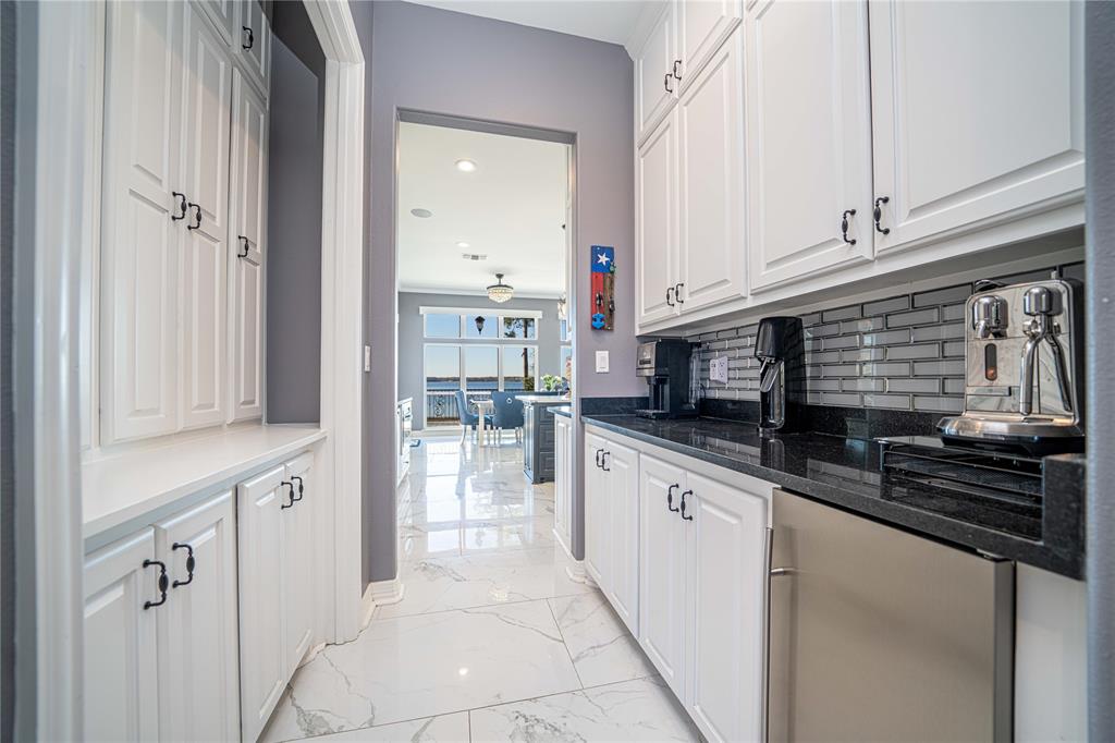 145 County Road Pittsburg, TX 75686 - Photo 7 of 39 a kitchen with stainless steel appliances granite countertop a sink and a stove