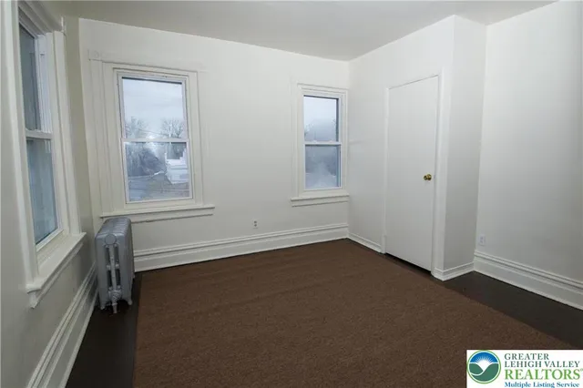 an empty room with windows