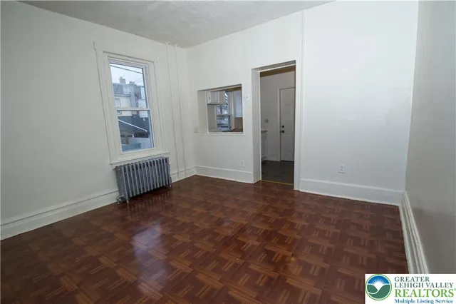 a view of an empty room and window