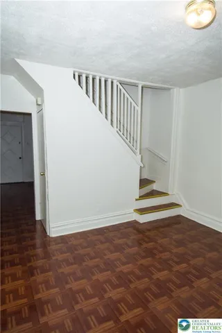 a view of entryway with wooden floor