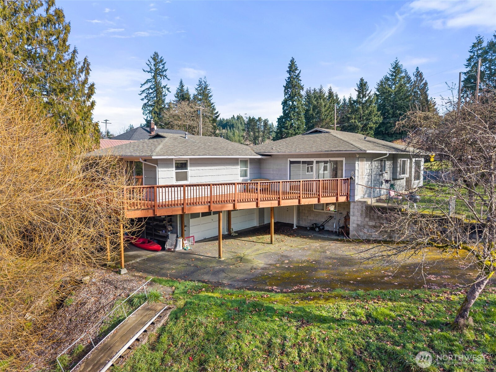 418 Southwest Canyon Loop Winlock, WA 98596 - Photo 2 of 35 a view of a house with backyard and sitting area