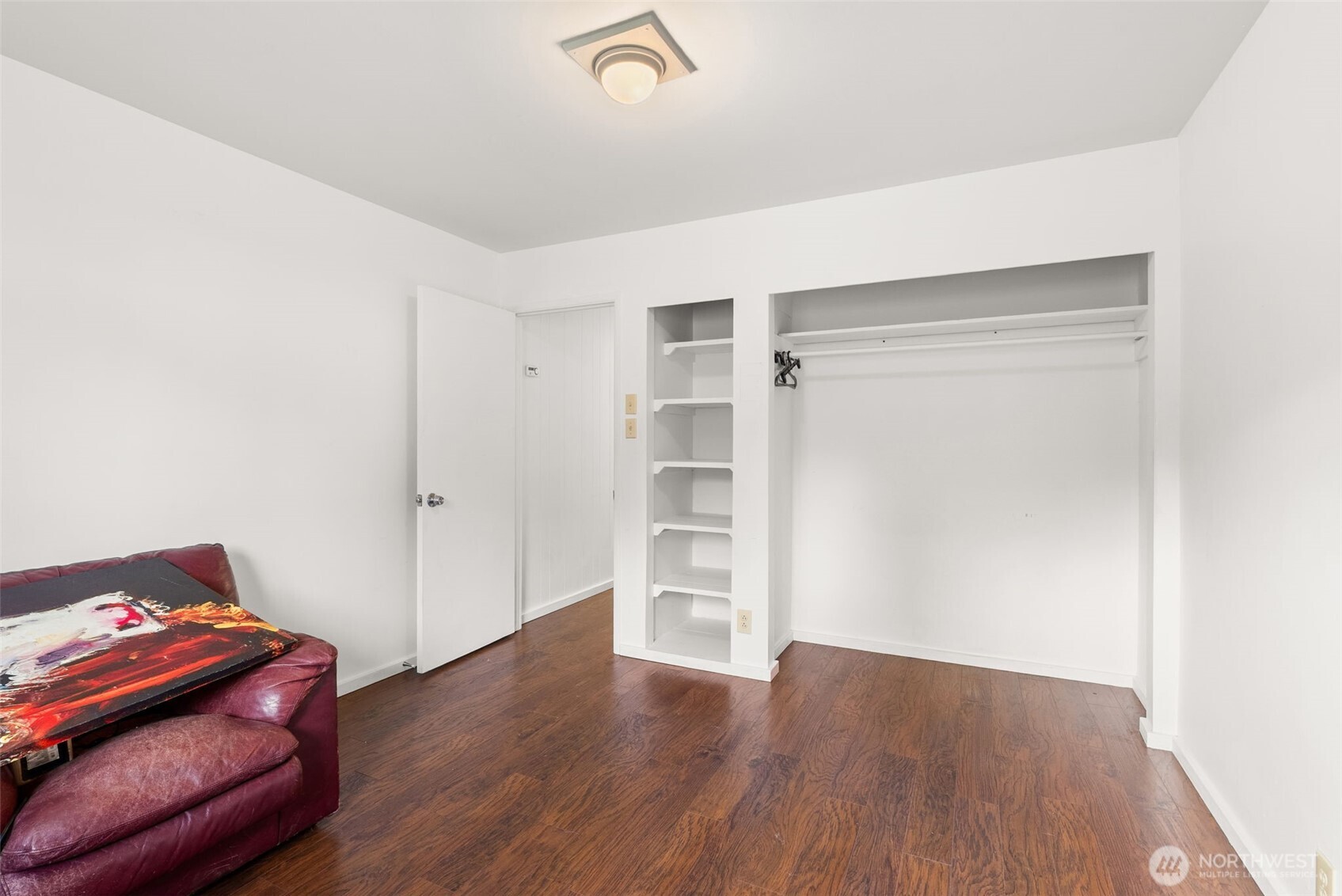 418 Southwest Canyon Loop Winlock, WA 98596 - Photo 22 of 35 a hallway with a dresser and wooden floor