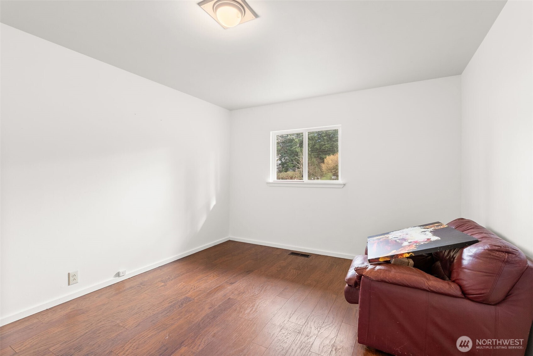 418 Southwest Canyon Loop Winlock, WA 98596 - Photo 23 of 35 a room with furniture and a wooden floor