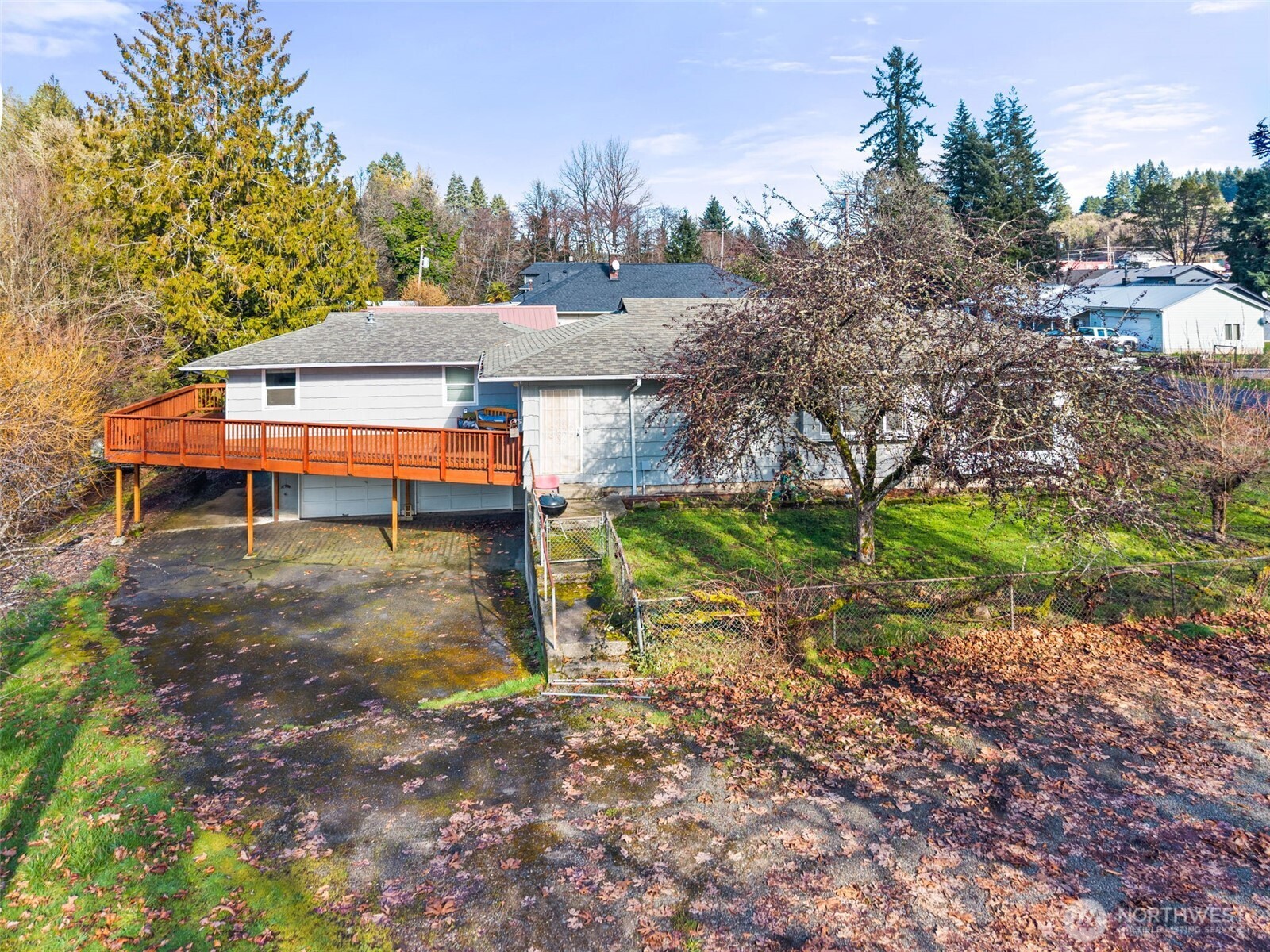 418 Southwest Canyon Loop Winlock, WA 98596 - Photo 34 of 35 a backyard of a house with a yard and outdoor seating